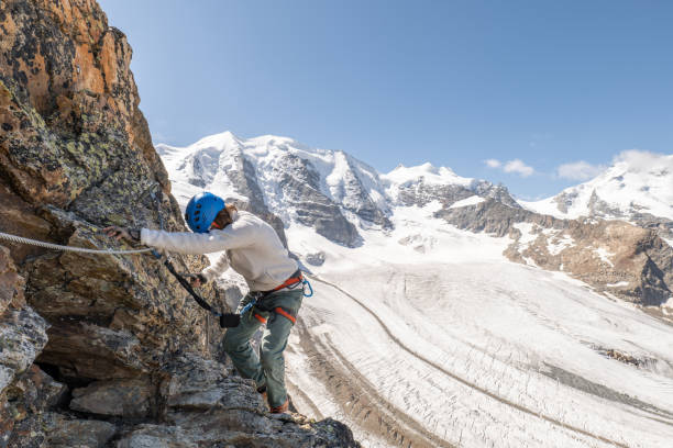 istock Man on Via Ferrata climbing up, glacier 1353590292