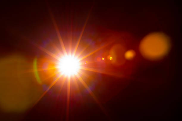 istock Sun flare on the black background 1353591387