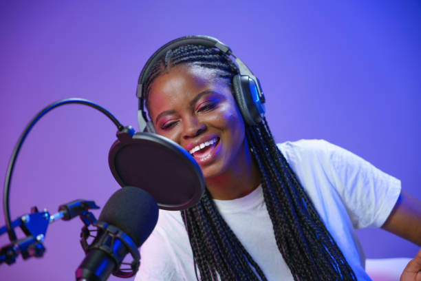istock Young blogger or radio DJ at the work 1353591677