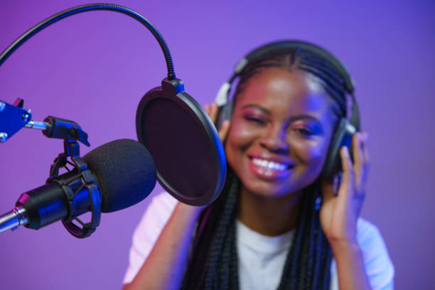 istock Blogger is streaming. Radio DJ at the work. 1353591713