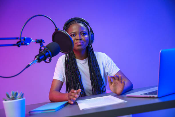 istock Blogger is streamig or radio Dj at the work 1353591764