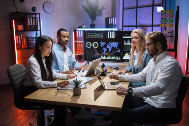 istock Multiracial team of financiers using gadgets at office 1353592834