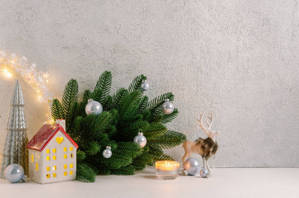 istock Christmas composition of Christmas decorations, pine branches, candle, deer and  copy space for text. Template. 1353593558