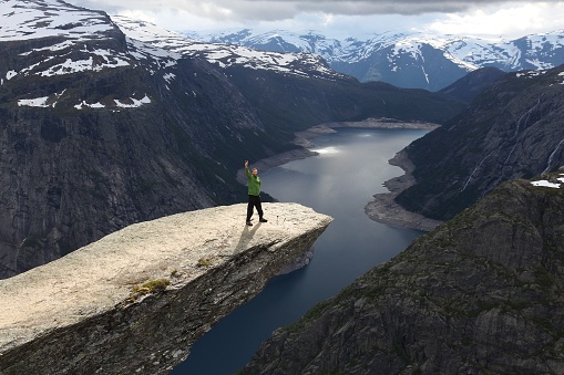 Trolltunga tourist - famous Troll's Tongue pulpit rock in Norway.
