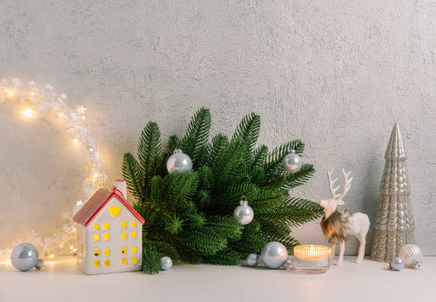 istock Christmas composition of Christmas decorations, pine branches, candle, deer and  copy space for text. Template. 1353595110