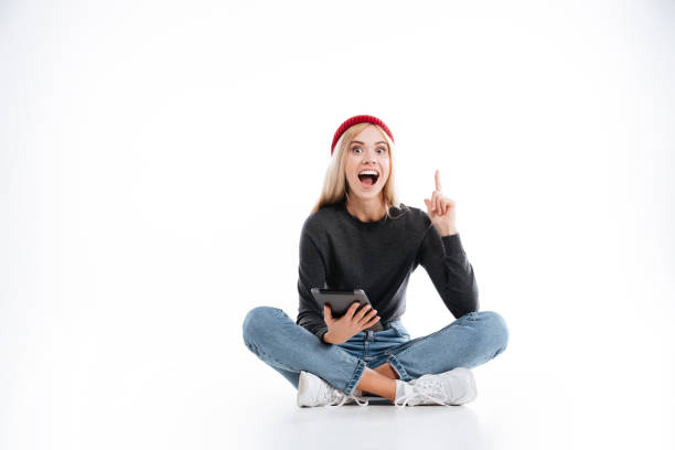 istock Happy Female Hipster sitting with tablet computer 1353595389