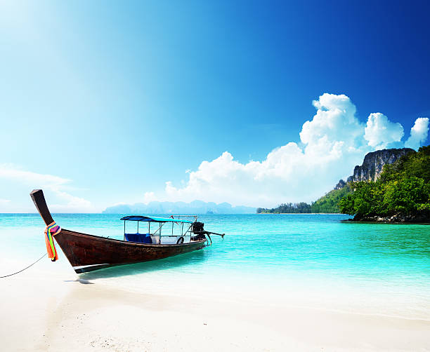 istock long boat and poda island in Thailand 135359626