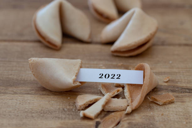 istock a fortune cookie with a blank paper strip and 2022 on it 1353596344
