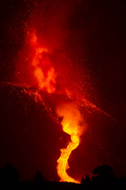istock Cumbre Vieja's volcano eruption. Volcanic cone and volcanic bombs going dawnhill. 1353597965