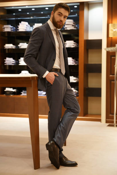 istock Vertical image of man posing in shop 1353597979