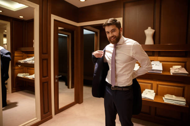 istock Happy Man putting on his jacket 1353598158