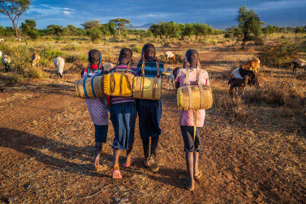 African children carrying water from the well, Kenya, East Africa