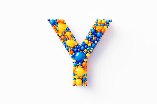 Colorful capital letter Y made of many spheres sitting on white background. Horizontal composition with clipping path and copy space. Directly above.