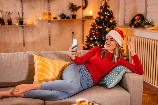 istock Young woman having video call at New year 1353602116