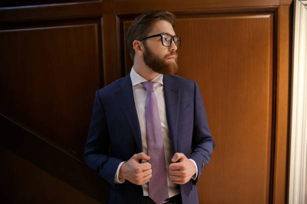 istock Concentrated bearded young businessman 1353602431
