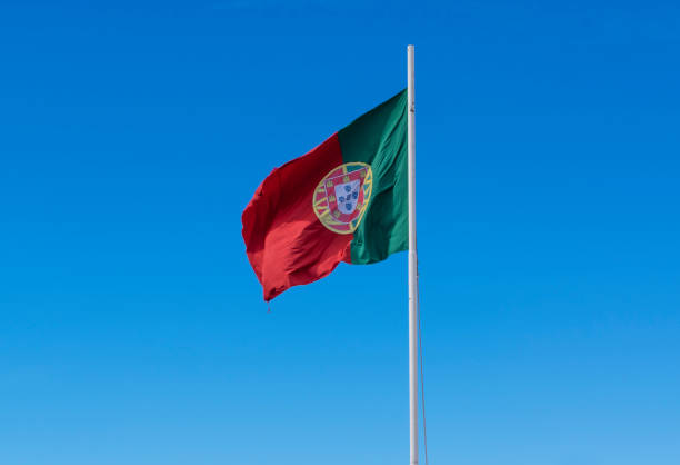 istock Portuguese flag against sky 1353603025