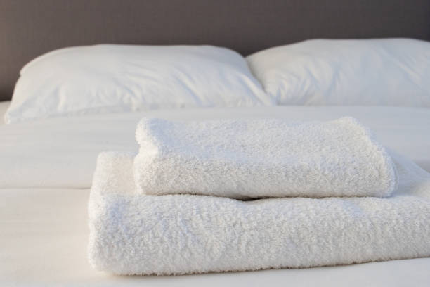 istock White clean towels stacked on the hotel bed 1353604318