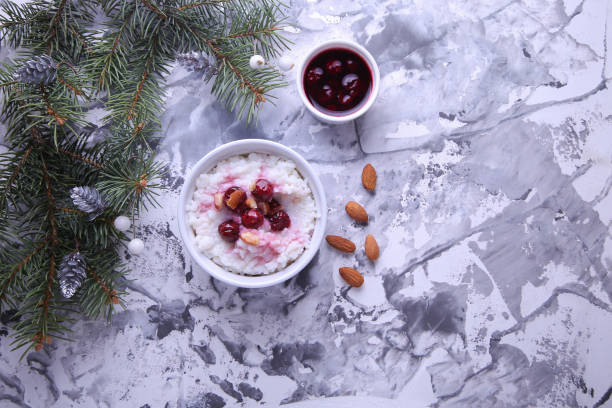 istock Christmas rice pudding with almonds and cherries on a light background with place for text. Risalamande 1353605983