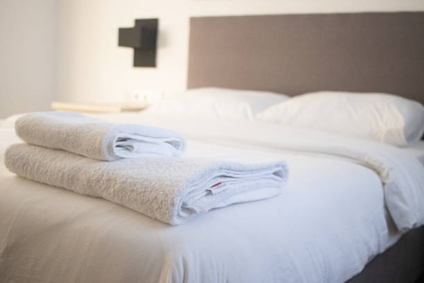 istock White clean towels stacked on the hotel bed 1353606658
