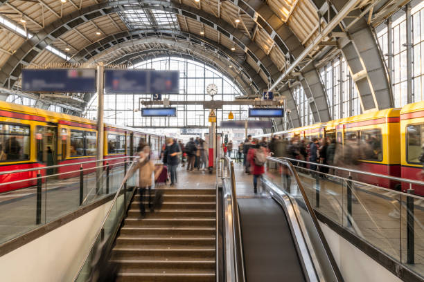 istock Groups of Commuters at Busy Train Station 1353611734