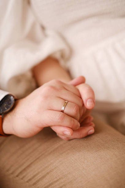 istock newlyweds hold each other's hands 1353612829