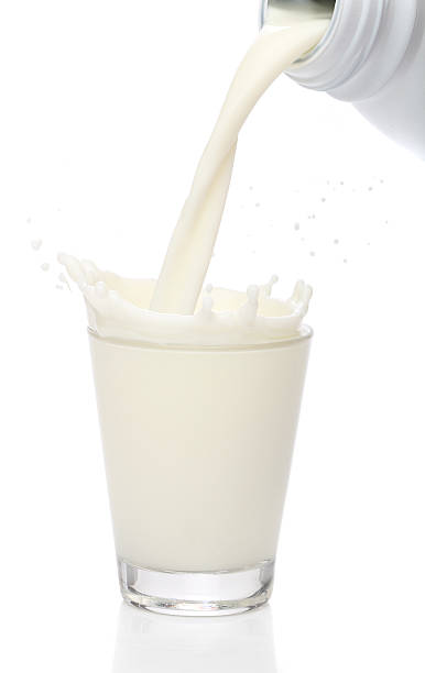 istock Bottle pouring milk into a glass. Splash 135361287