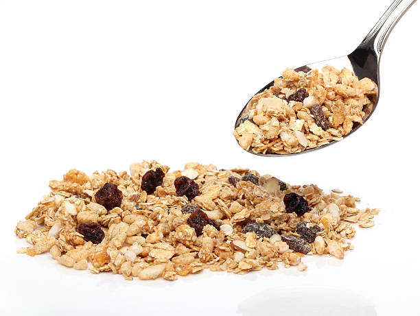 istock Granola cereals on a spoon over white background 135361290
