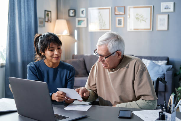 istock Senior man paying for bills online 1353613033