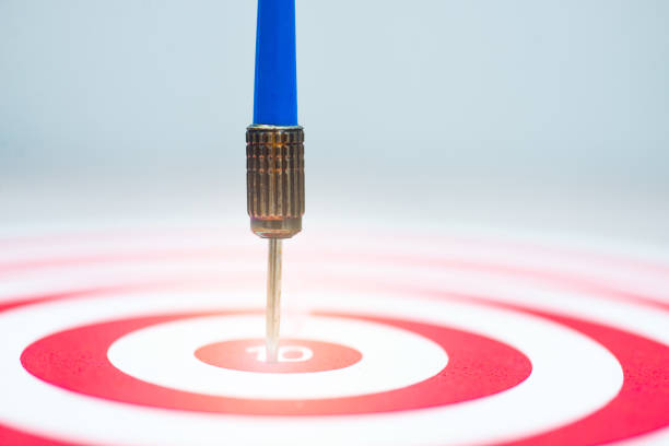 istock dartboard with arrow. creative concept idea for success with focus point on target to the winner in business with strategy management aim to leadership. 1353613151