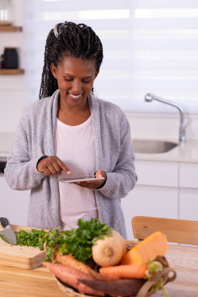 istock A woman looking for a recipe on tablet. 1353613439