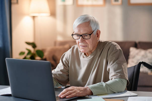 istock Senior man working online on laptop 1353613596