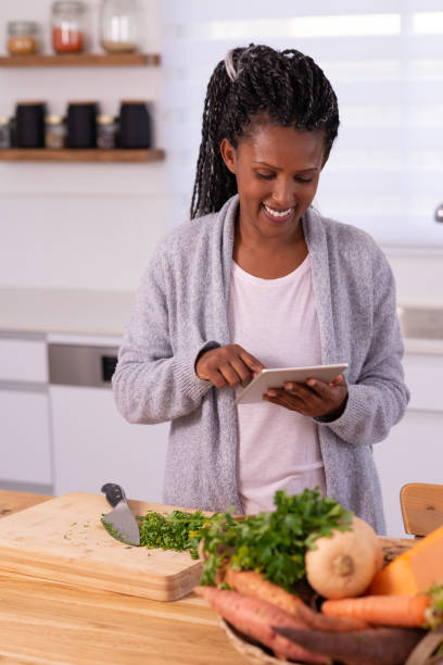 istock A woman looking for a recipe on tablet. 1353614183