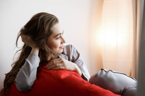 istock Pretty woman lying on chair bag 1353614217