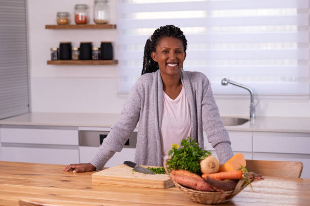 istock Woman preparing food in the kitchen. 1353614459