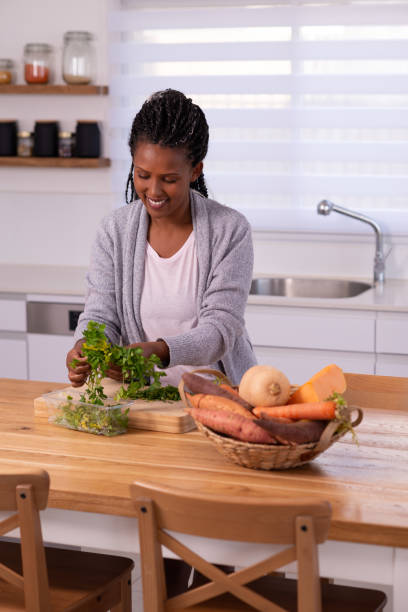 istock Woman preparing food in the kitchen. 1353614673