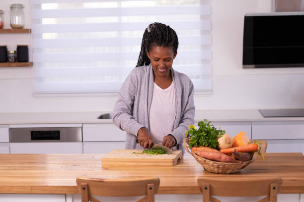istock A woman cutting cilantro. 1353615387