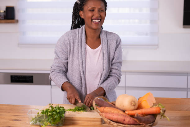istock A woman cutting cilantro. 1353615713