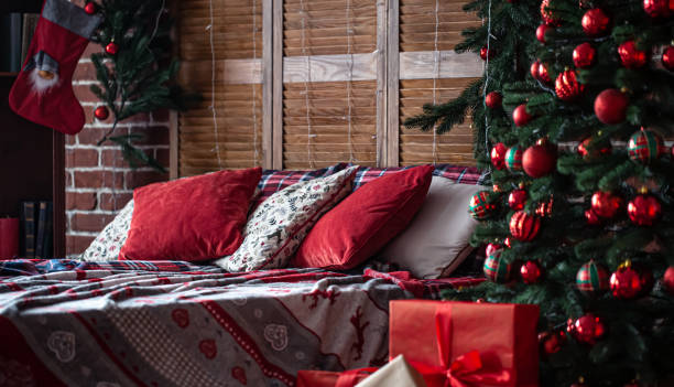 istock Bedroom interior with Christmas tree and decor details. 1353615808