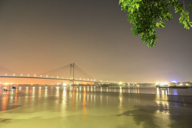 istock Beautiful famous Kolkata Hoogly bridge in night time. 1353616049