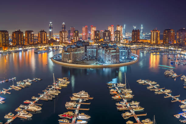 Pearl Qatar Porto Arabia The Pearl Qatar Doha. it is an artificial island in Qatar. View of the Marina and residential buildings in Porto Arabia Doha doha stock pictures, royalty-free photos & images