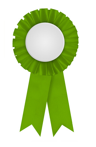 Circular pleated green ribbon winners rosette with blank white center for applying a design to. Photographed on a blank white background.
