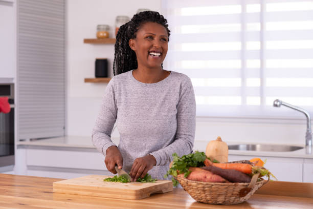 istock A woman cutting cilantro. 1353618599