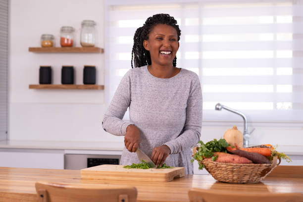 istock A woman cutting cilantro. 1353618662