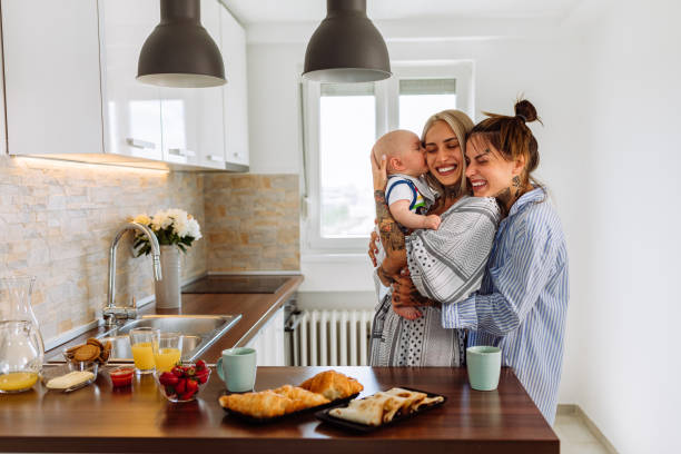 istock Affectionate women enjoying in time with a baby son at home 1353620971