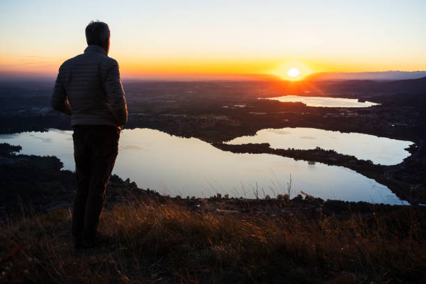 istock Hiker contemplate the sunset landscape 1353624818