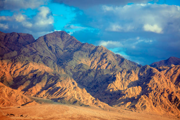 istock Beautiful dramatic mountain landscape during sunset. Mountain ridge background 1353624876