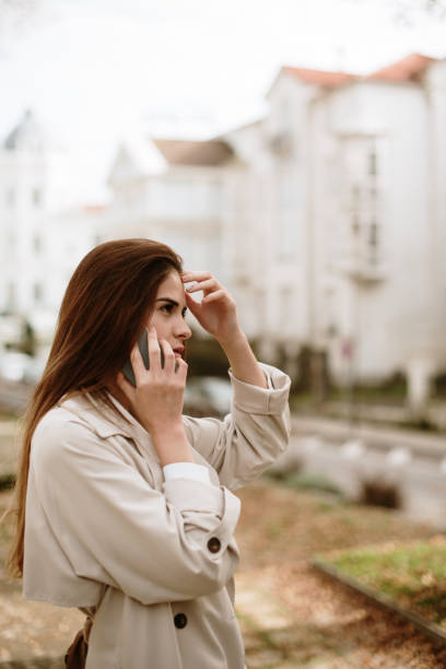 istock Young woman speaking on the phone 1353626340