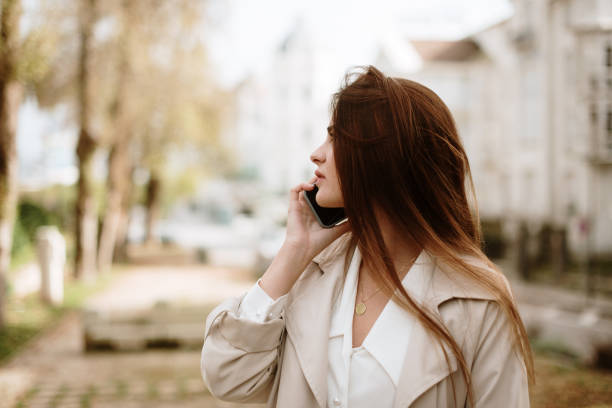istock Young woman speaking on the phone 1353626434