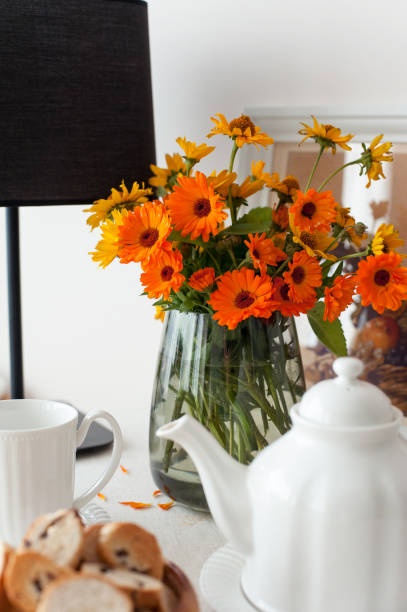 istock Round table for morning fresh tea with tablecloth and flowers 1353629044