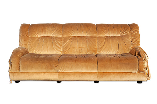 Old brpwn sofa isolated on white background. Clipping path included.